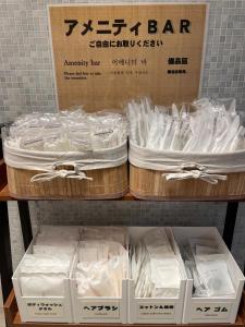 two boxes of white shirts on a shelf at Ochanomizu Inn - Vacation STAY 90241v in Tokyo