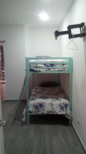 a green bunk bed in a room with a shelf at Monte Mar 7A in Divisadero