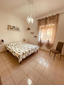 Een bed of bedden in een kamer bij Appartamento di Anna