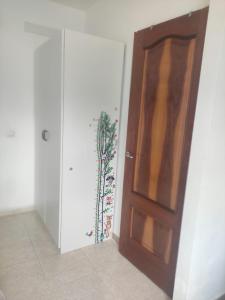 a wooden door in a room with a wall at Crismela in Yaiza