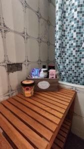 a bathroom with a wooden counter top in a room at Yellow and blue relax house in Piraeus +39 photos
