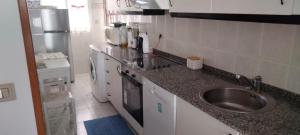 Kuchyň nebo kuchyňský kout v ubytování Apartamento Atico Altar