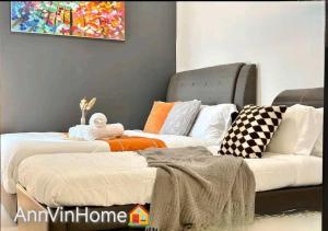 a living room with two beds and a couch at Novo 8 2-Bedrooms Condo Extreme City View Suite in Malacca