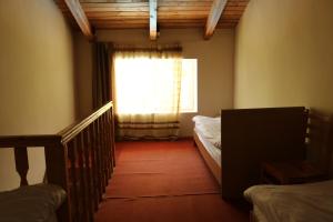 Voodi või voodid majutusasutuse Taoskari Hotel toas