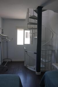 Posteľ alebo postele v izbe v ubytovaní IMPLUVIUM Conil-Terraza Privada-Parking- mayores de 25 años