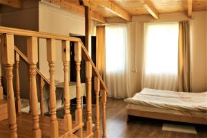 Postel nebo postele na pokoji v ubytování Taoskari Hotel