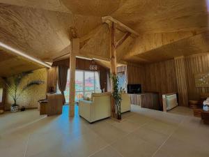 a large living room with a couch and a tv at Seagull Studio Byala in Byala