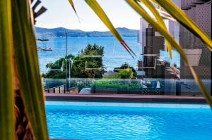 a swimming pool with a view of the water at Dedaj Resort - Villa Almaro in Zadar