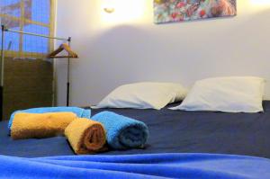 a bed with a stuffed animal on top of it at Convés in Monte