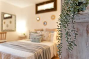 A bed or beds in a room at SARDINIA RE - Casa Luisa With Pool