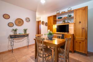 A television and/or entertainment centre at SARDINIA RE - Casa Luisa With Pool