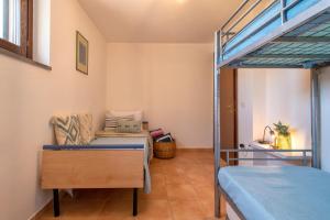 A bed or beds in a room at SARDINIA RE - Casa Luisa With Pool