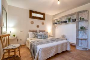 A bed or beds in a room at SARDINIA RE - Casa Luisa With Pool