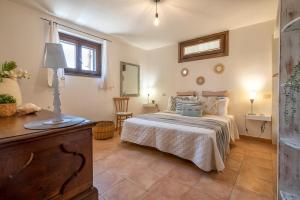 A bed or beds in a room at SARDINIA RE - Casa Luisa With Pool