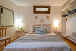 A bed or beds in a room at SARDINIA RE - Casa Luisa With Pool