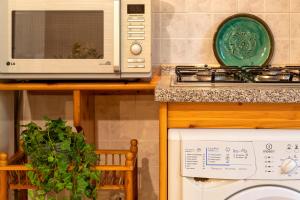 A kitchen or kitchenette at SARDINIA RE - Casa Luisa With Pool