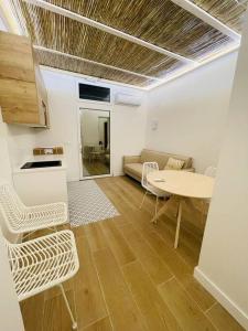 a living room with a couch and a table at casa Albufera boutique in Valencia