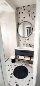 a bathroom with a sink and a mirror at Vila Damir in Gradac