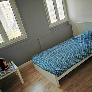 מיטה או מיטות בחדר ב-Résidence Zola