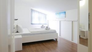 Postel nebo postele na pokoji v ubytování Tomic Apartments