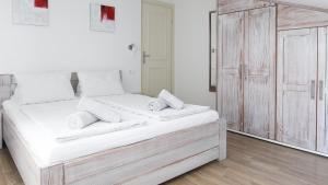 Postel nebo postele na pokoji v ubytování Tomic Apartments