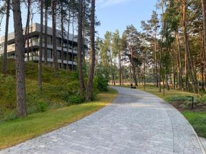 a brick road in front of a building at Rogowo 117J Shellter Apartments in Rogowo