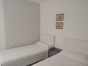 Postel nebo postele na pokoji v ubytování Apartamento MORCHE - TORROX PRIMERA LINEA DE PLAYA
