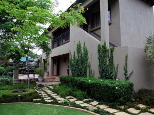a house with a garden in front of it at East View Guesthouse in Pretoria
