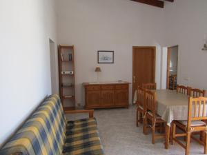 a living room with a dining room table and chairs at Casa Antonia ET- 6805 in Sant Francesc Xavier