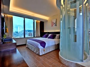 Voodi või voodid majutusasutuse The Bauhinia Hotel - Tsim Sha Tsui toas