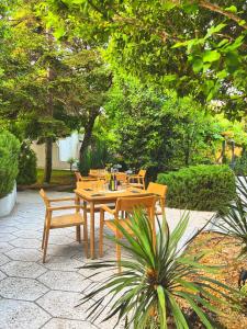 A garden outside Friends Family Hotel