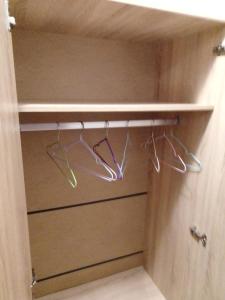 a closet with two hoses and two hangers at bellissimo студио близо до плажа in Ravda