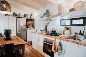 a kitchen with a sink and a stove top oven at Hau Lodge Malalcahuello Corralco Starlink in Malalcahuello