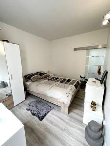 Cama o camas de una habitación en Un appartement Cosy et Lumineux