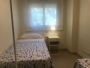 Katil atau katil-katil dalam bilik di Apartaments Les Palmeres Coma-ruga