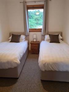 Säng eller sängar i ett rum på Kings Reach - Dunadd Cottage