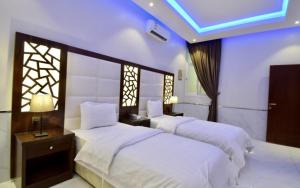 Cama o camas de una habitación en شاليهات لوسيرن (عوائل)