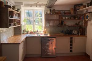 a kitchen with a sink and a window at Whichford Mill-large Cotswold Home in Shipston on Stour