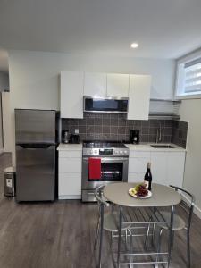 a kitchen with a table with a plate of food on it at Studio sous-sol Lachine 10 min de DT in Montreal