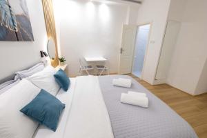 Voodi või voodid majutusasutuse Old Town Rooms toas