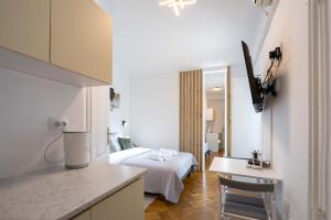 Voodi või voodid majutusasutuse Old Town Rooms toas