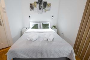 Voodi või voodid majutusasutuse Old Town Rooms toas