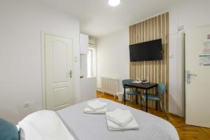 Voodi või voodid majutusasutuse Old Town Rooms toas
