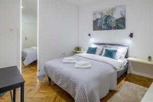Voodi või voodid majutusasutuse Old Town Rooms toas