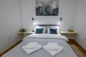 Voodi või voodid majutusasutuse Old Town Rooms toas