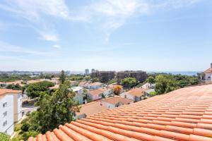 a view of a city from the roof of a building at Cascais Terrace in Cascais