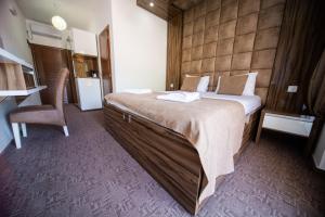 Postel nebo postele na pokoji v ubytování Hotel ŠARS