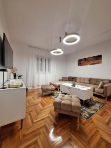 a living room with a couch and a table at Apartman K. & M. KOLUMBIĆ in Sveta Nedelja