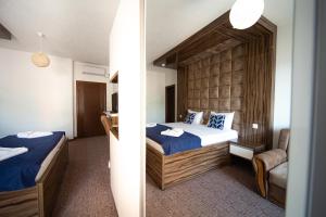 Postel nebo postele na pokoji v ubytování Hotel ŠARS