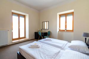 Ένα ή περισσότερα κρεβάτια σε δωμάτιο στο Hotel Prácheň